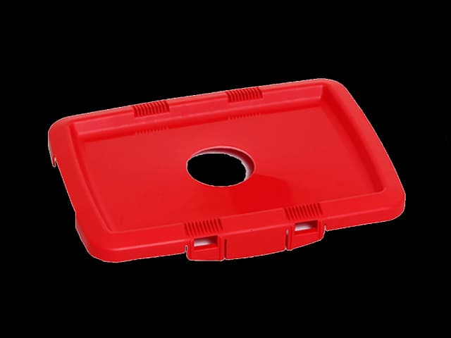 Rødt batterilokk til sorteringsboks. Foto.