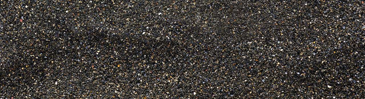 Pile of Black islandic sand macro photo studio